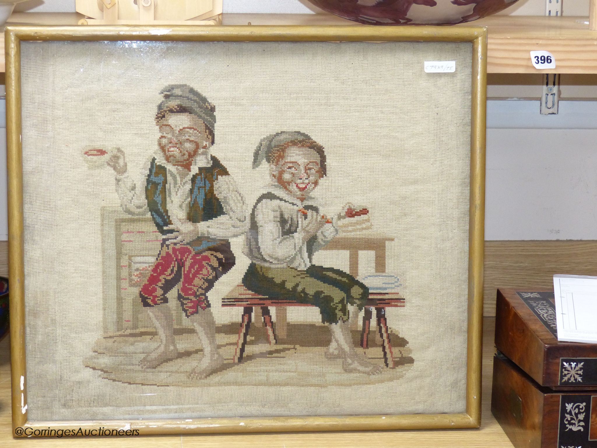 A Victoian petit-point needlework picture, two playful youths